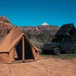 beautiful tent setup in desert with rv