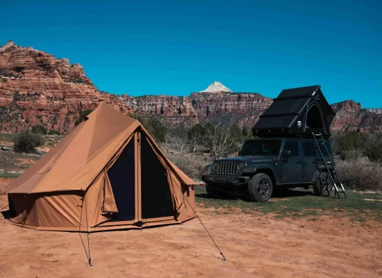 beautiful tent setup in desert with rv