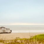 beautiful tent setup on beach for camping