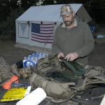 man organizing the camping gear