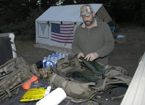 man organizing the camping gear
