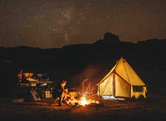 man enjoying campfire during camping under the shining stars