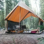 beautiful tent setup for camping in peaceful forest