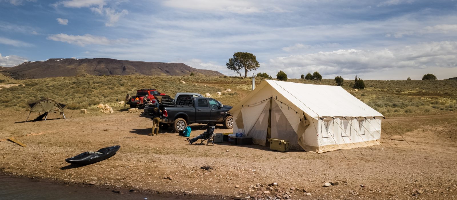wall tent for hunting near the lake - hunting adventure