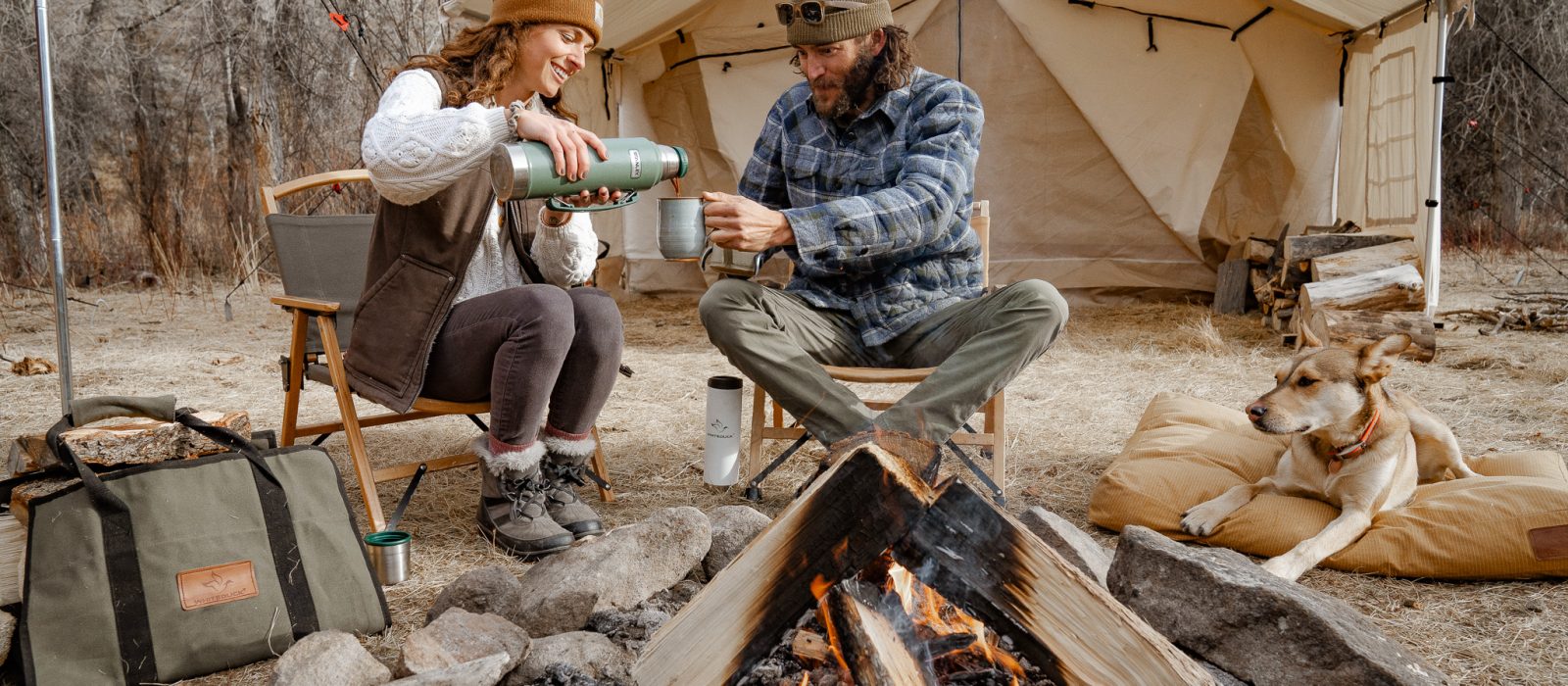 couple enjoying campfire on their camping trip