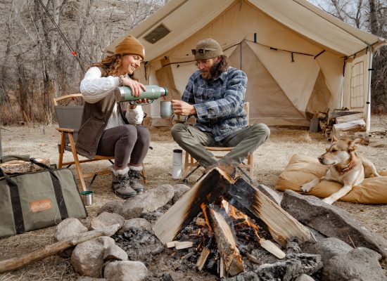 couple enjoying campfire on their camping trip