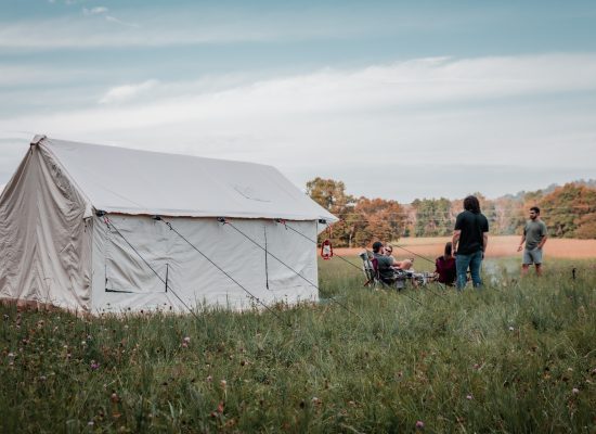 friends enjoying camping with canvas wall tent