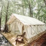 wall tent setup for glamping in the forest