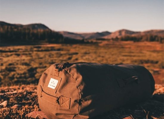 white duck outdoor's duffle bag