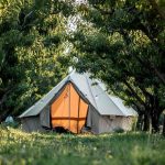canvas bell tent in forest