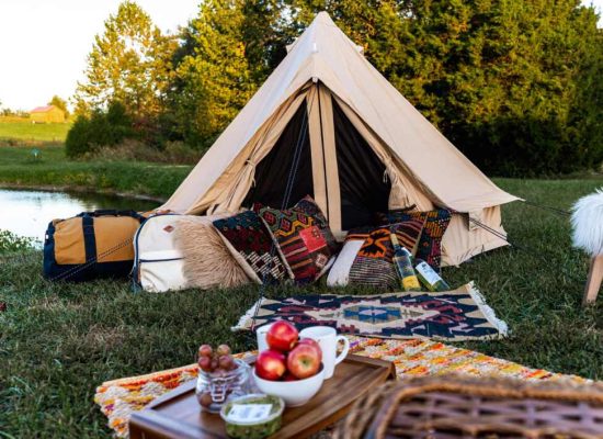 beautiful bell tent setup by the river