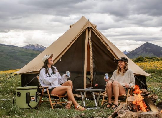 friends enjoying outdoors with bell tent
