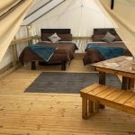 beautiful glamping setup with white duck tent