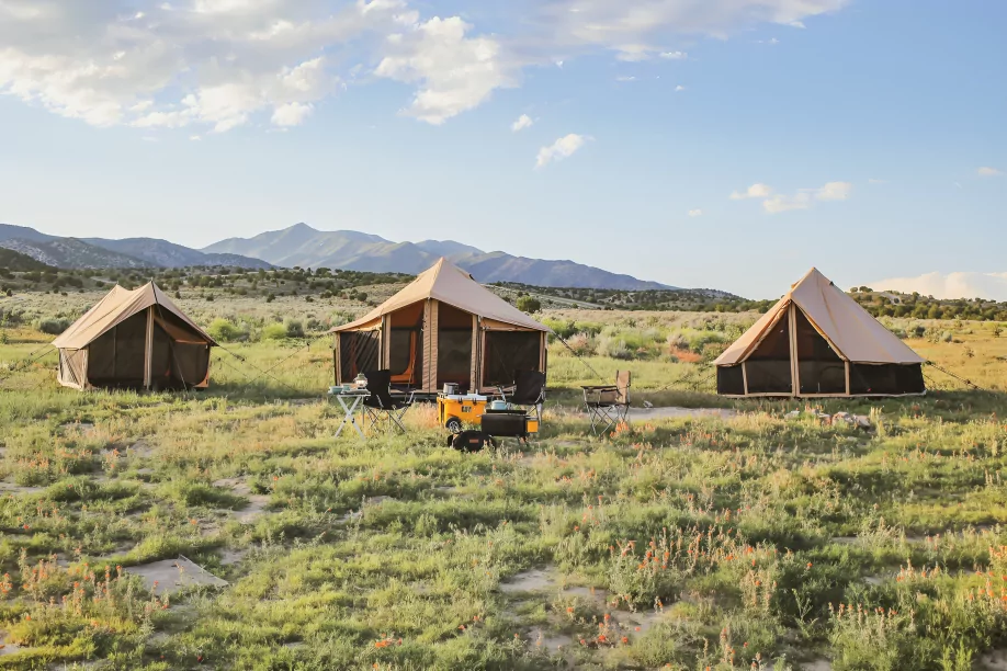 beautifull tents setup for camping with mountains behind
