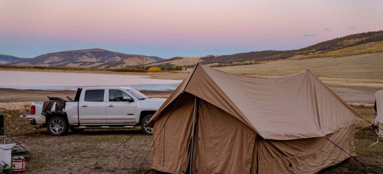 camping with canvas tent near the lake