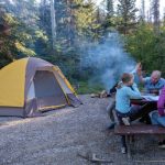 family enjoying game in the camping trip