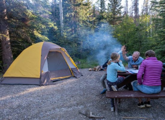 family enjoying game in the camping trip