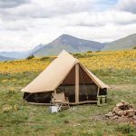 beautiful camp setup in plains with amazing mountain view