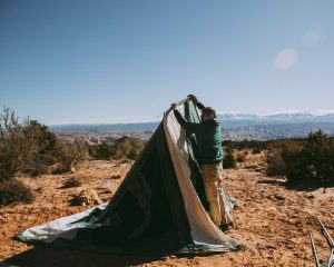 man setting up cabin tent for perfect outdoor adventure