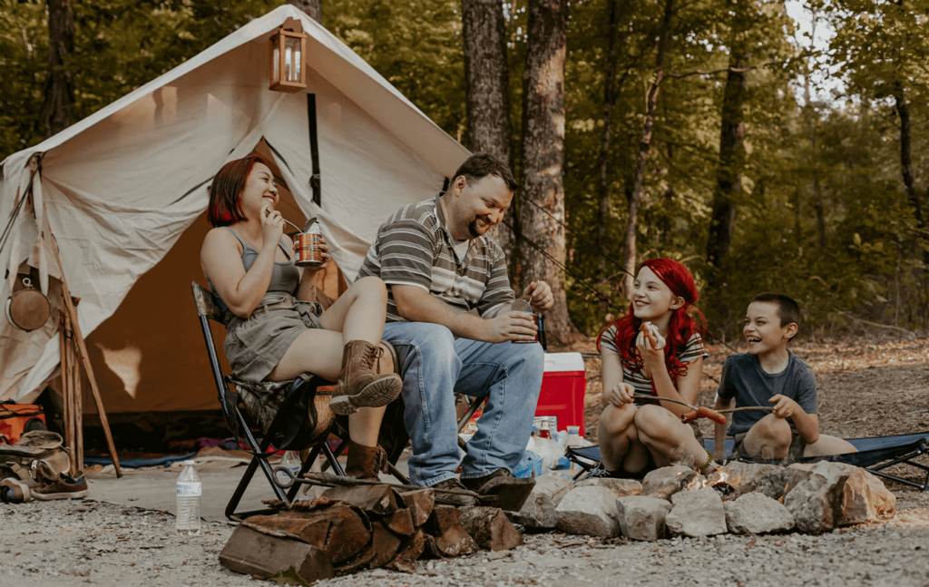 family enjoying meal on camping