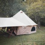beautiful bell tent setup in forest for camping