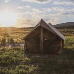 beautiful canvas tent setup in plains for camping