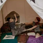 kids playing in the cozy tent setup for camping