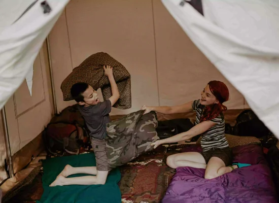 kids playing in the cozy tent setup for camping