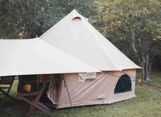 canvas camping tent setup with rainfly sheet for comfortable camping