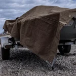 truck setup for camping shelter with tarp