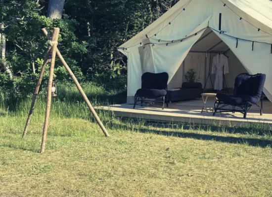wall tent setup in backyard for party