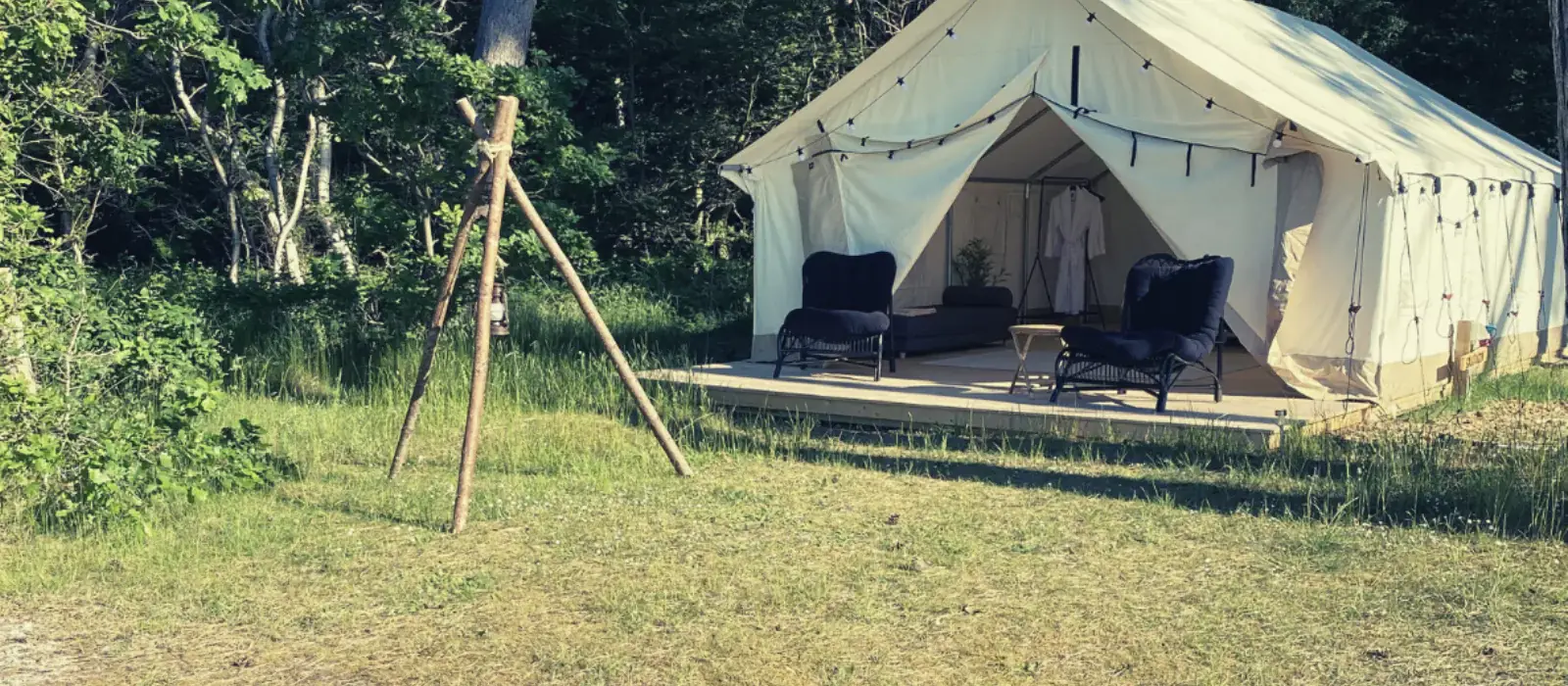 wall tent setup in backyard for party