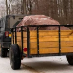 truck in the forest setup for truck bed camping