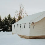 canvas tent heated with propone heater in snow