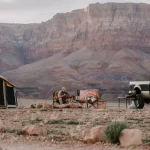 4 season tent in mountains with 4x4 vehicle for outdoor adventure