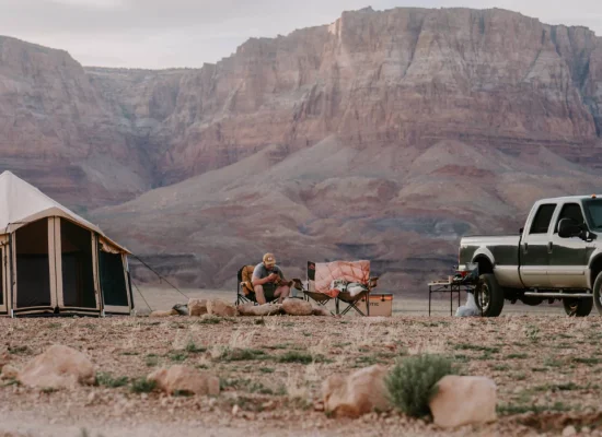 4 season tent in mountains with 4x4 vehicle for outdoor adventure