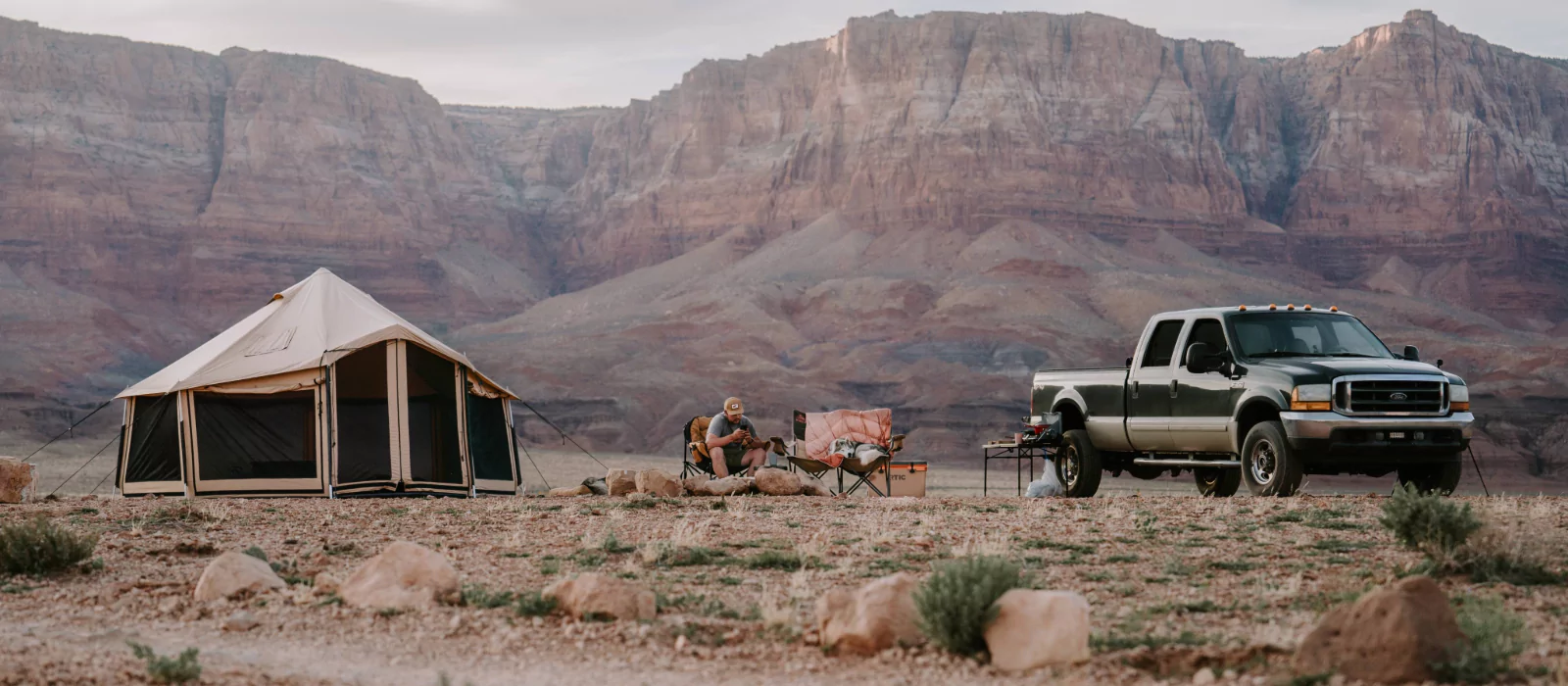 4 season tent in mountains with 4x4 vehicle for outdoor adventure