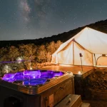 canvas tent setup perfectly with jacuzzi to stay cool in festival camping