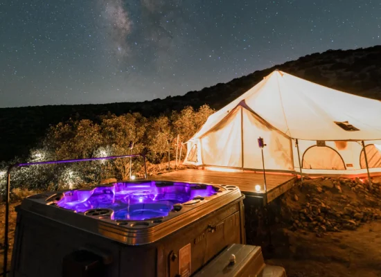 canvas tent setup perfectly with jacuzzi to stay cool in festival camping