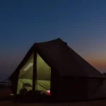 canvas tent setup for stargazing. night sky camping