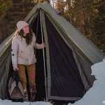 winter tent setup in snow for camping
