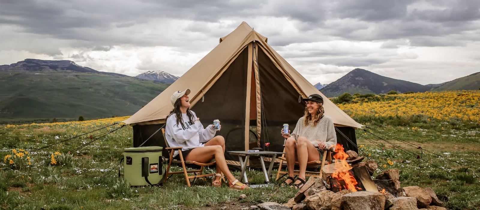 friends enjoying campfire games on camping adventure