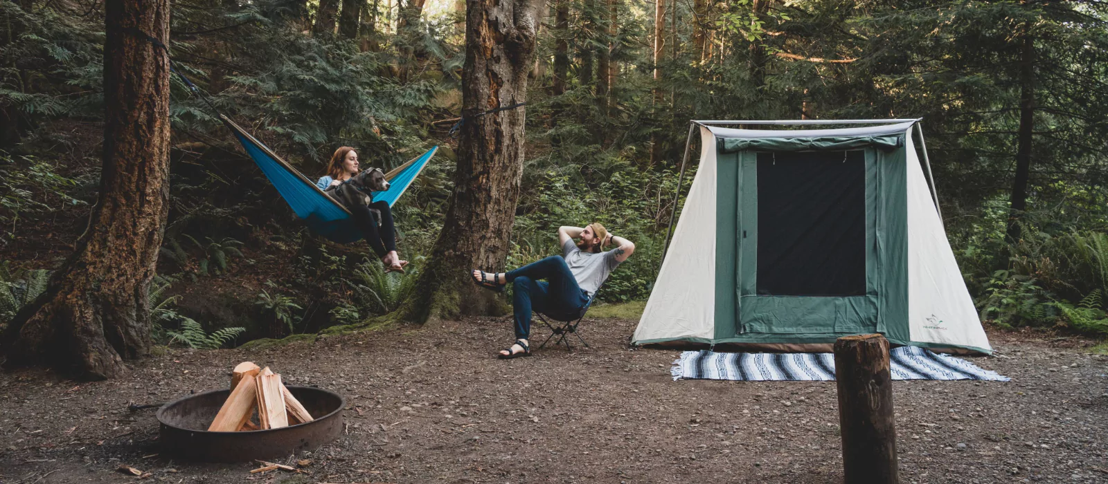 couple sharing campfire stories on camping in forest
