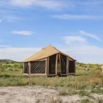 canvas tents setup in plains for camping