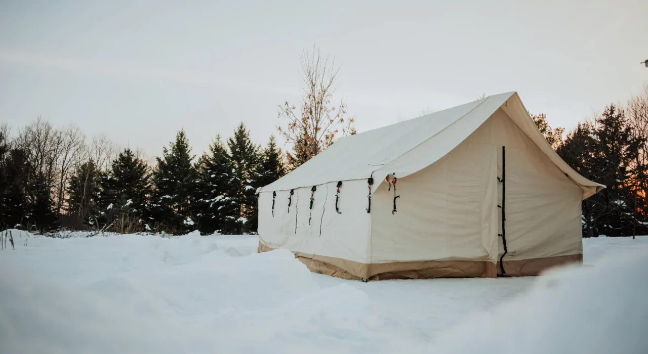Wall tent in snow for winter hot tent camping
