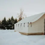 Wall tent in snow for winter hot tent camping