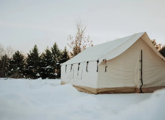 Wall tent in snow for winter hot tent camping