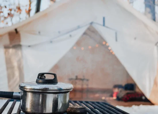 canvas tent setup in snow for hot tent camping