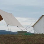 diy shade created beside the tent on beautiful landscape