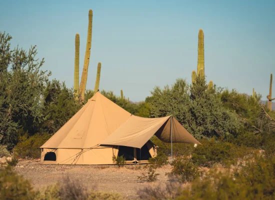 bell tent setup in desert during summer camping